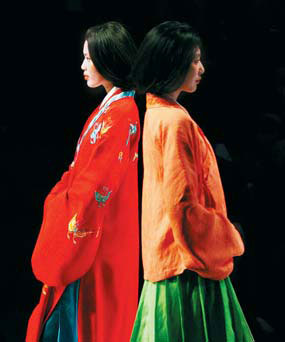 Models display Chinese-style clothes at a show during this year's China Fashion Week. 